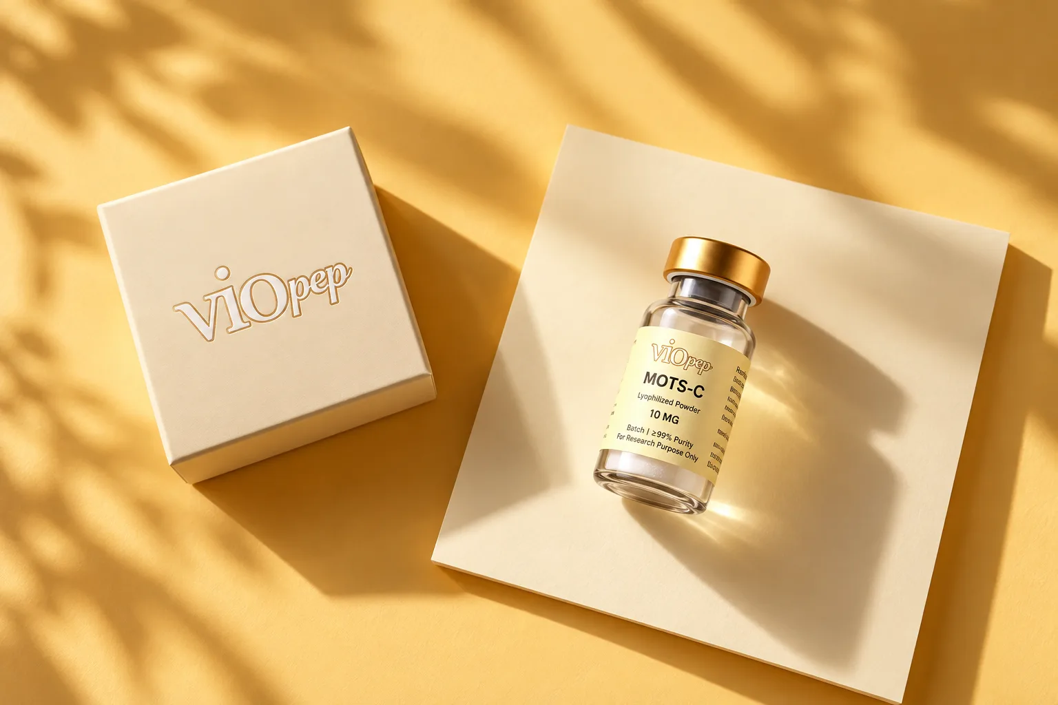 A labeled viopep vial on a cream card beside an embossed viopep box, on a yellow ground in dappled light